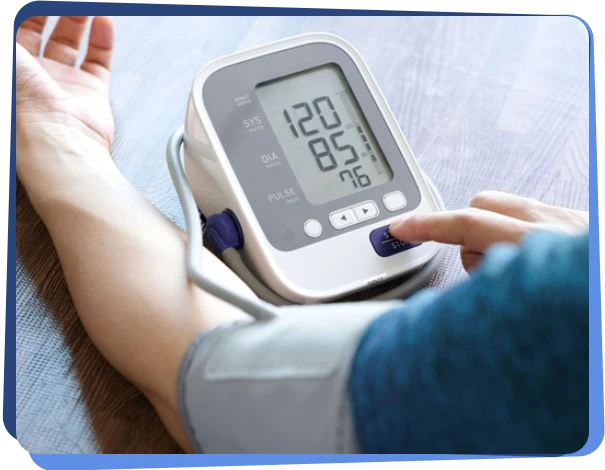 Digital blood pressure monitor being used on a patient's arm