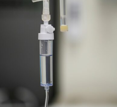 Intravenous saline bag and drip chamber used for iron infusions